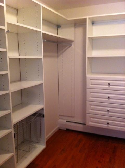 Traditional Closet with raised panel cabinetry