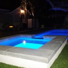 Contemporary Pool with hot tub overflow into pool