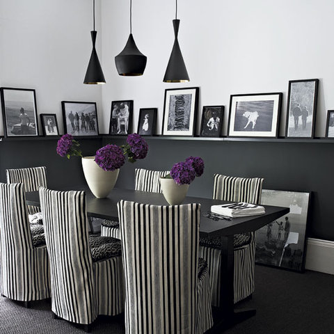Eclectic Dining Room with striped dining chair covers