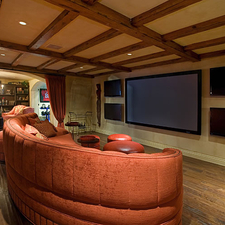 Eclectic Home Theater with hand scraped plank wood floor