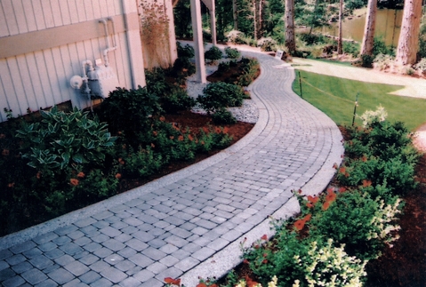 Transitional Landscape with gray cobblestone walkway