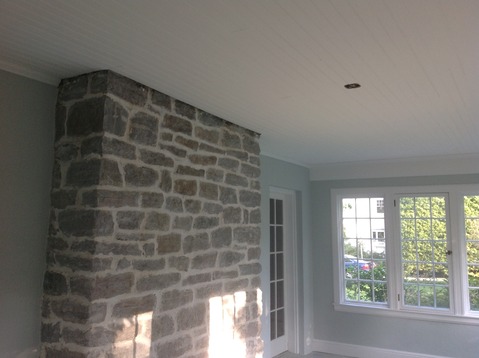 Contemporary Sunroom with mortared stacked stone chimney