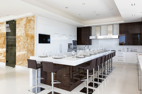 Modern Kitchen with large stainless steel range hood