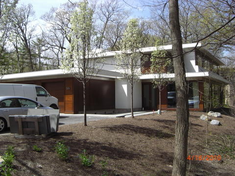 Modern Home Exterior with dark wood panel siding