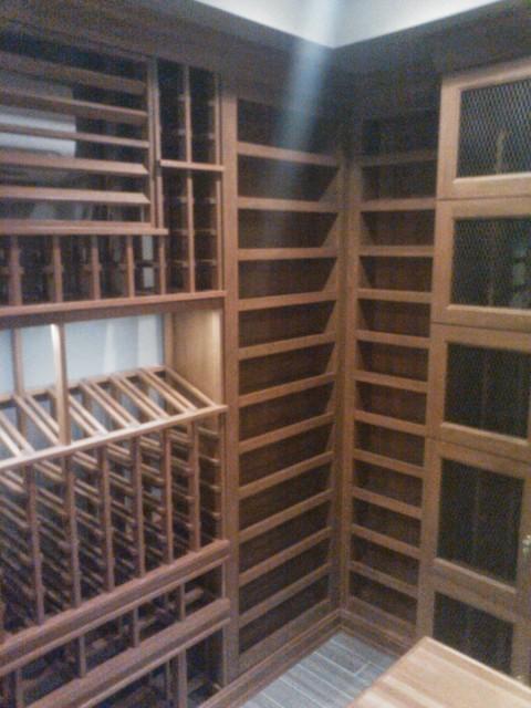 Contemporary Wine Cellar with wire glass cabinets