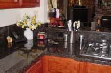 Ash Marble & Granite - Tops, Inc. logo
