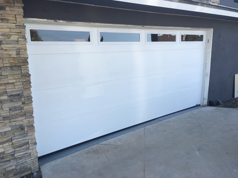 Transitional Garage with windowed garage door