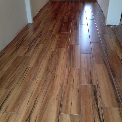 Transitional Entry with faux wood ceramic tile floor floor