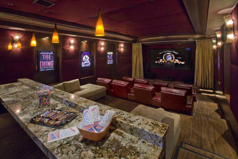 Traditional Home Theater with red leather theater seats