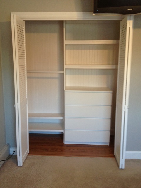 Traditional Closet with white louvered doors