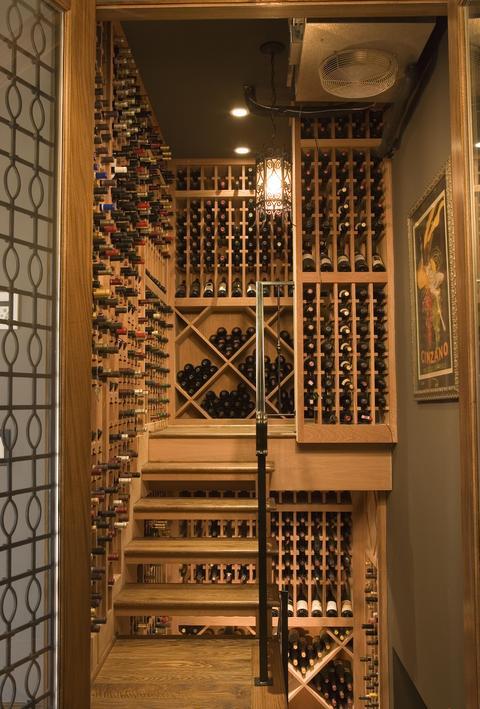 Contemporary Wine Cellar with light wood bottle storage