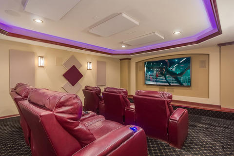Eclectic Home Theater with beige wall paint and sound panels