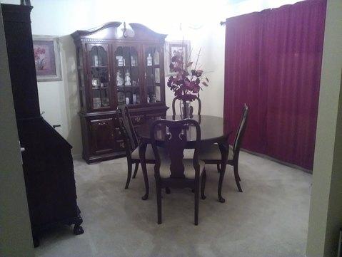 English Dining Room with tan wall to wall carpet