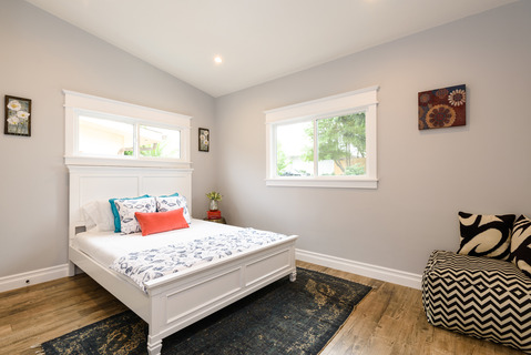 Casual / Comfortable Bedroom with wood panel headboard