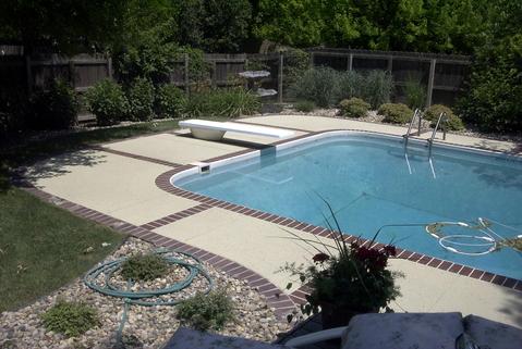Casual / Comfortable Pool with weatherd wood privacy fence