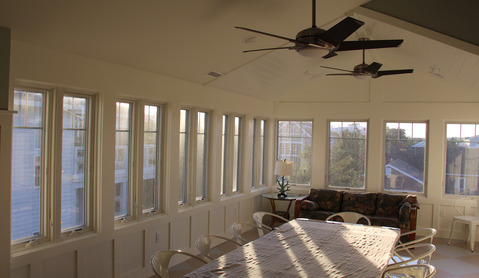 Contemporary Sunroom with white wood lighted ceiling fan