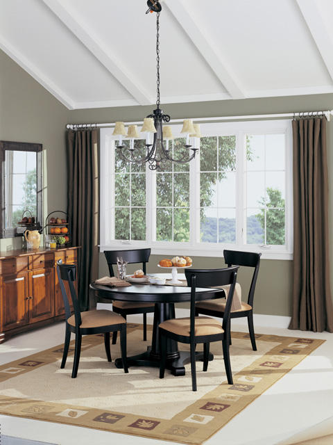 Transitional Dining Room with wrought iron chandelier