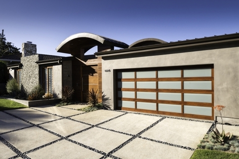 Modern Home Exterior with wood and frosted glass garage door