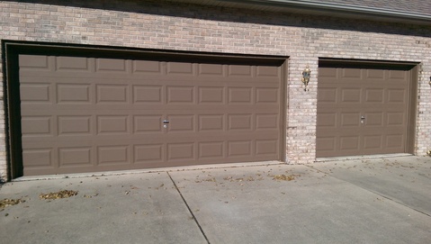 Transitional Garage with two car panel garage door