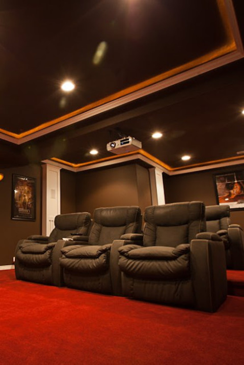 Traditional Home Theater with large black theater seating