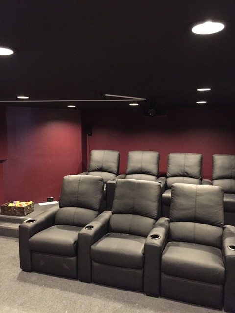 Traditional Home Theater with black leather theater chairs