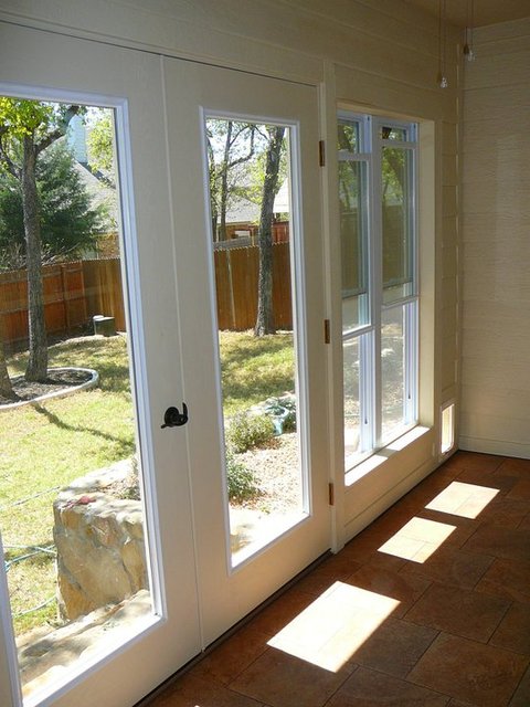 Contemporary Sunroom with glass panel exterior french doors