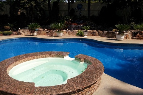 Casual / Comfortable Pool with stacked stone low wall