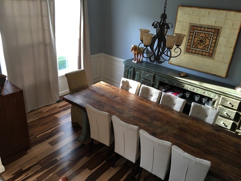 Eclectic Dining Room with rough sawn wood plank table top