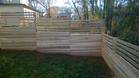 Modern Landscape with 4 foot horizontal slat and plank fence