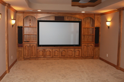 Traditional Home Theater with built in wood cabinetry