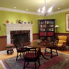 Eclectic Dining Room with wide white floor molding