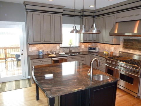 Transitional Kitchen with black and grey cabinet crown molding