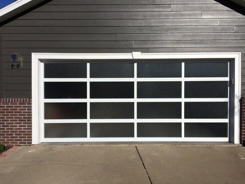 Modern Garage with textured glass garage door