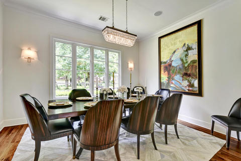Transitional Dining Room with zebra wood and black leather chair