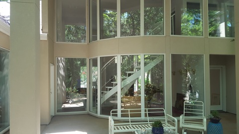 Modern Sunroom with glass wall of windows
