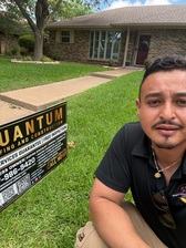 Quantum Roofing & Construction logo