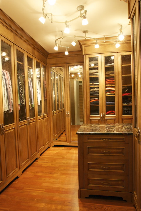 English Closet with glass front wardrobe doors