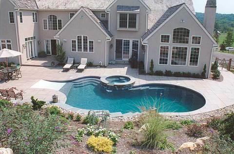 Traditional Pool with sloped in ground pool