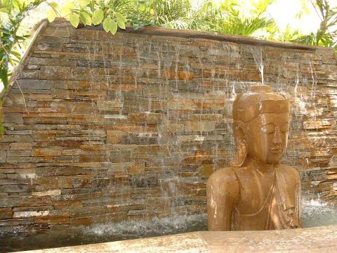Transitional Landscape with large water wall feature