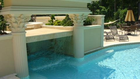 Traditional Pool with ornate stone carved columns