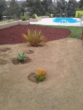 Logo for Tommy's landscaping and construction