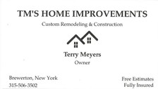 TM's Home Improvements logo