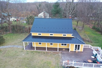 Luna Siding & Roofing logo