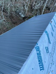 B&J Roofing and Construction logo
