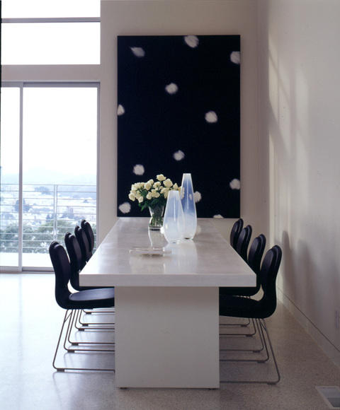 Modern Dining Room with long white stone dining table