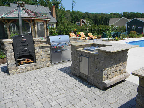 Transitional Landscape with stone paver patio