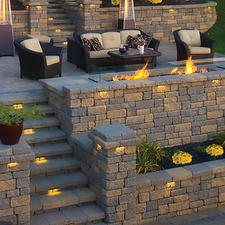 Transitional Patio with light cushions on dark wicker furniture