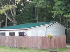 Logo for Troyer's Roofing