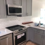 Gray Shaker Cabinets with Alaska White Countertops