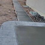 Backyard concrete patio and walkway